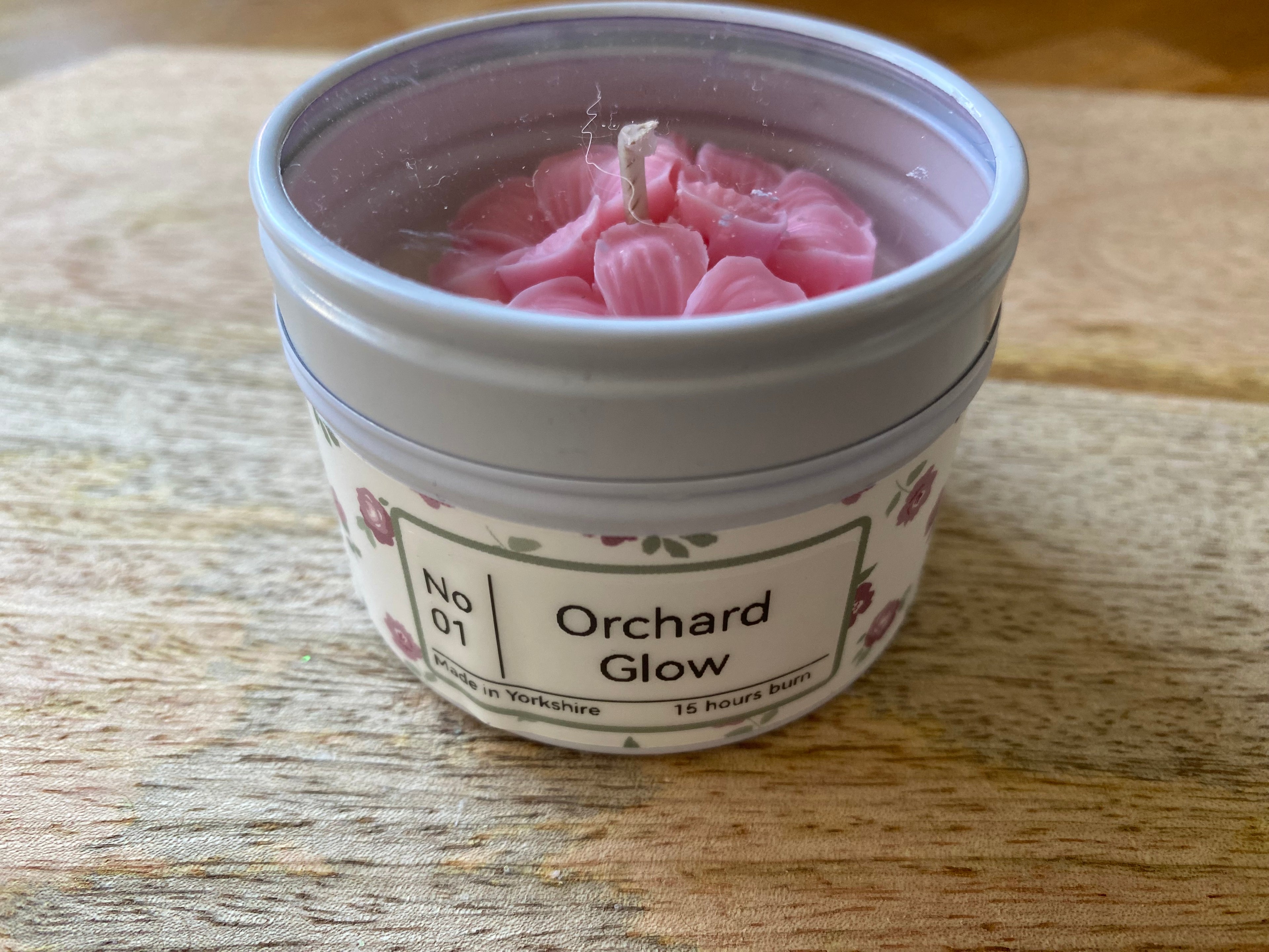 Hand poured tin candle with wax floral finishing - Orchard Glow